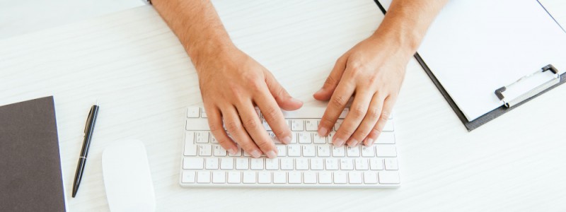 Partners Finances broker typing on computer keyboard
